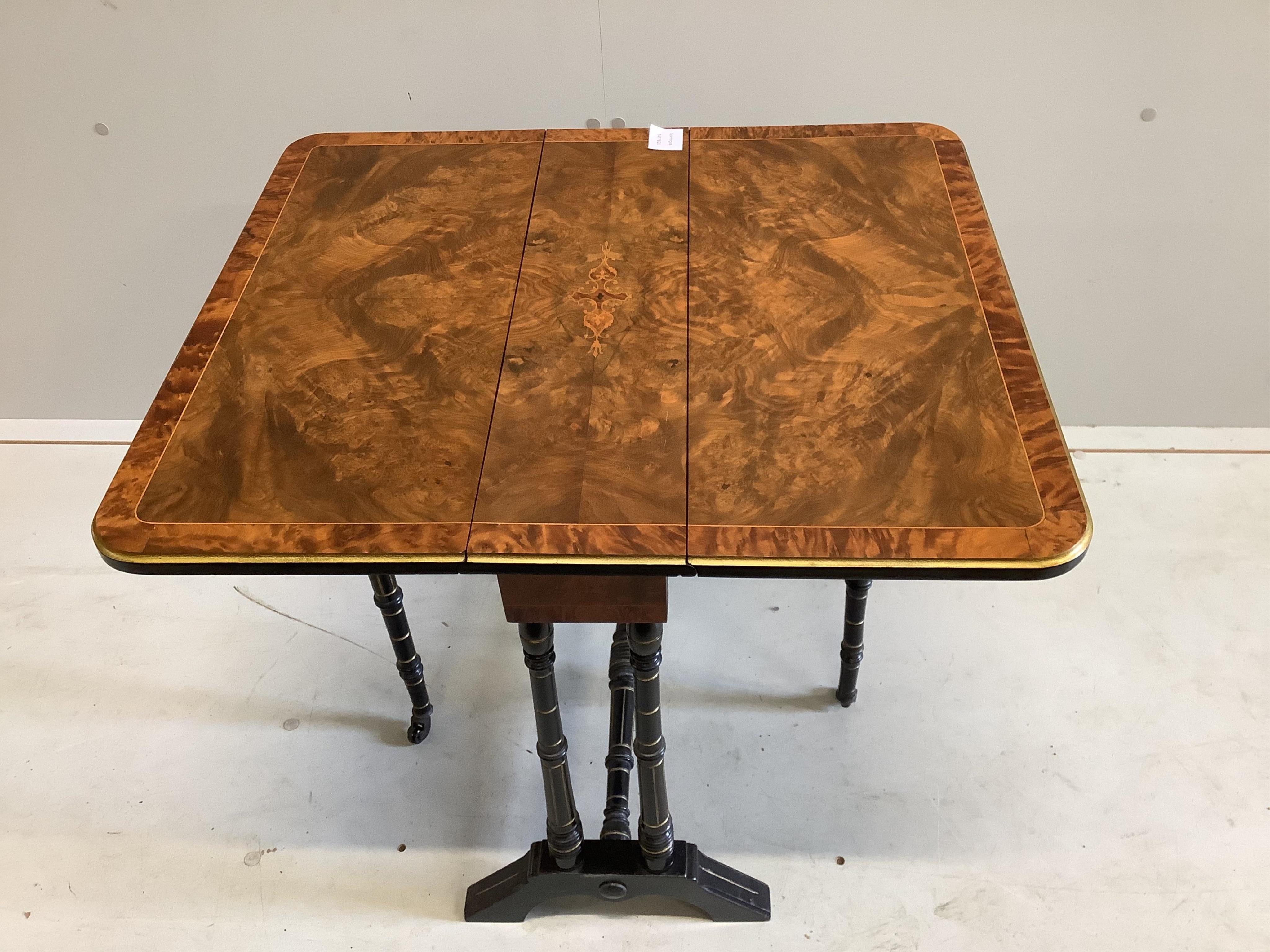 A late Victorian inlaid walnut and ebonised Sutherland table, width 56cm, depth 16cm, height 54cm. Condition - good